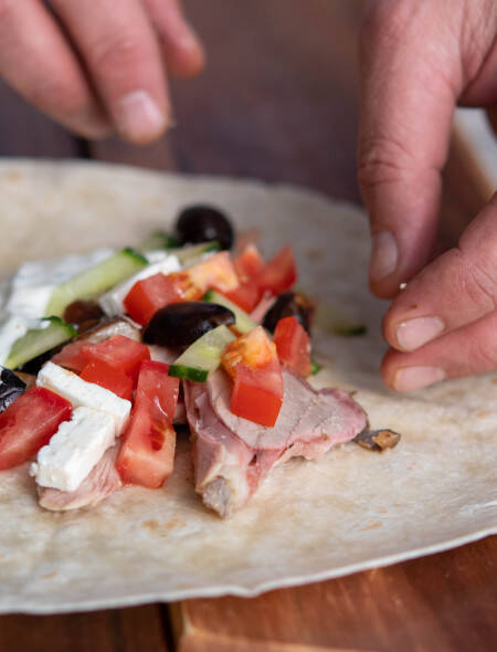 Lamb wrap with oriental salad - rolling